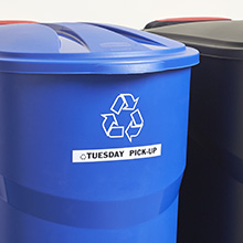 blue recycle bin with Tuesday pickup label