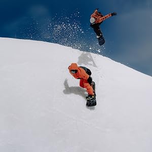 two men snowboarding