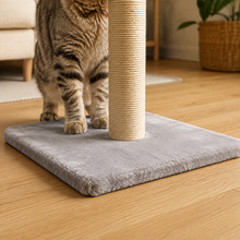 Close view of the square gray plush-covered base