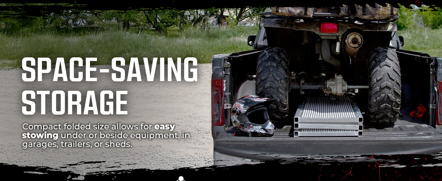 Folded ATV ramp stored in truck bed with ATV and helmet, showing compact space-saving design.