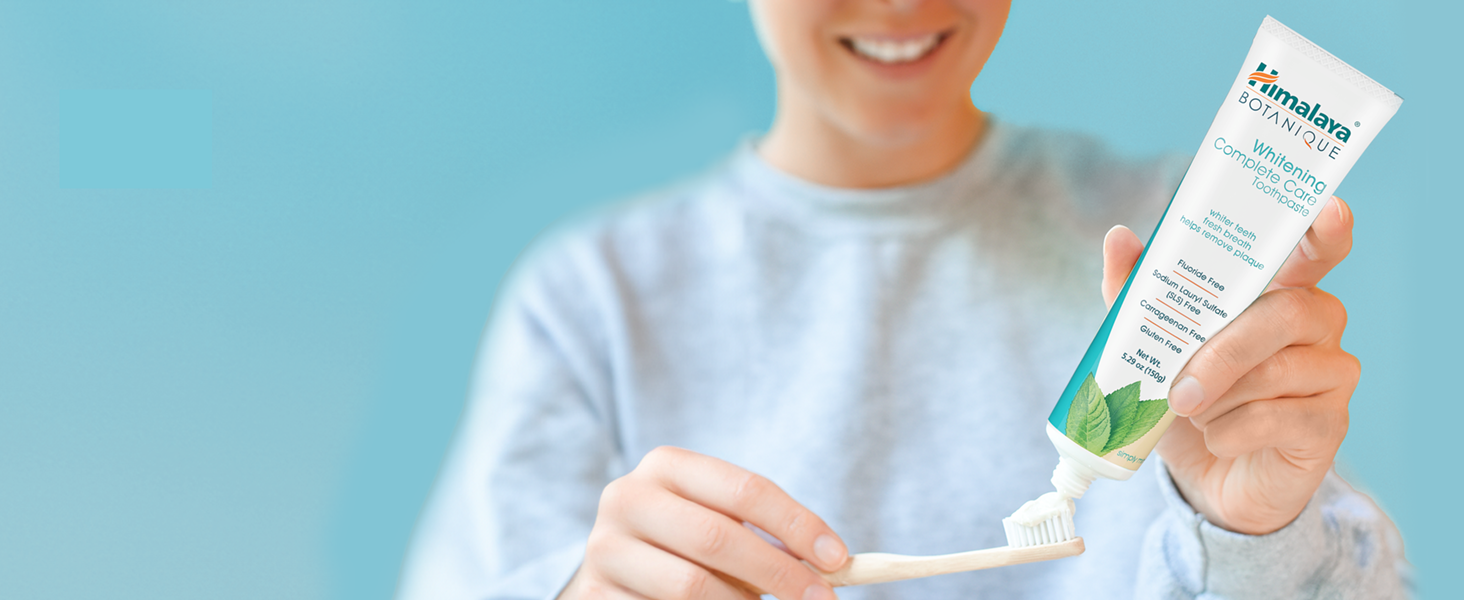 woman and toothpaste