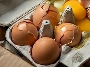 jumbo eggs in a carton cracked