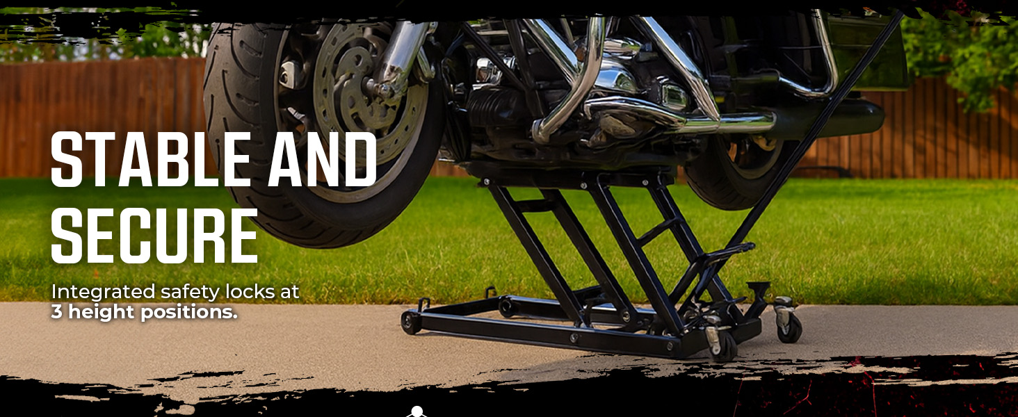 Motorcycle on dolly with five locking casters, showcasing smooth mobility in a garage setting.