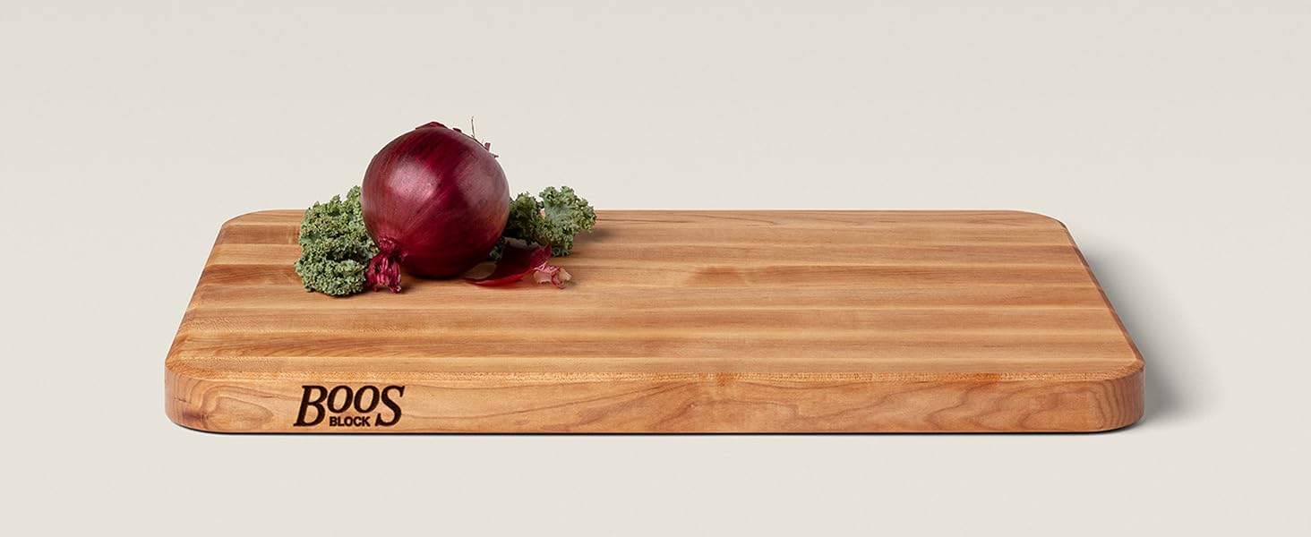 Boos Block Maple Wood Edge Grain Cutting Board with berries on top.