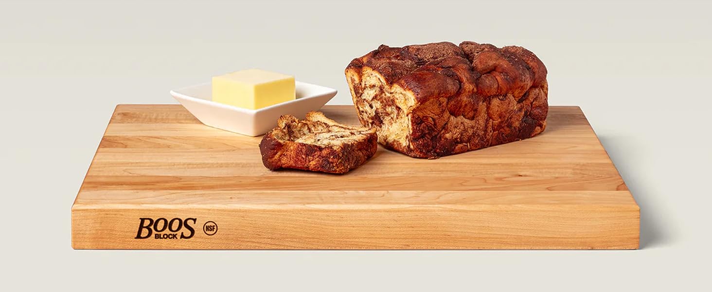 Image of John Boos Maple cutting board with bread and butter on top.