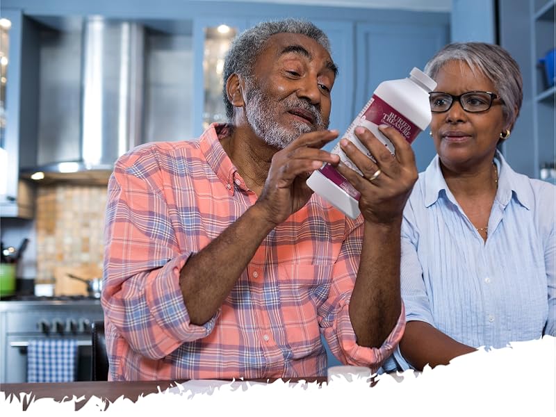 Elderly couple looking at supplement
