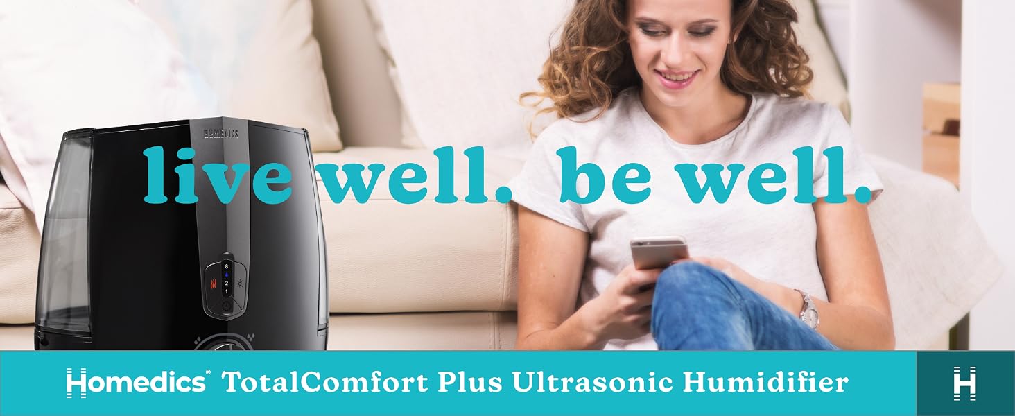woman on phone sitting next to black humidifier in living room