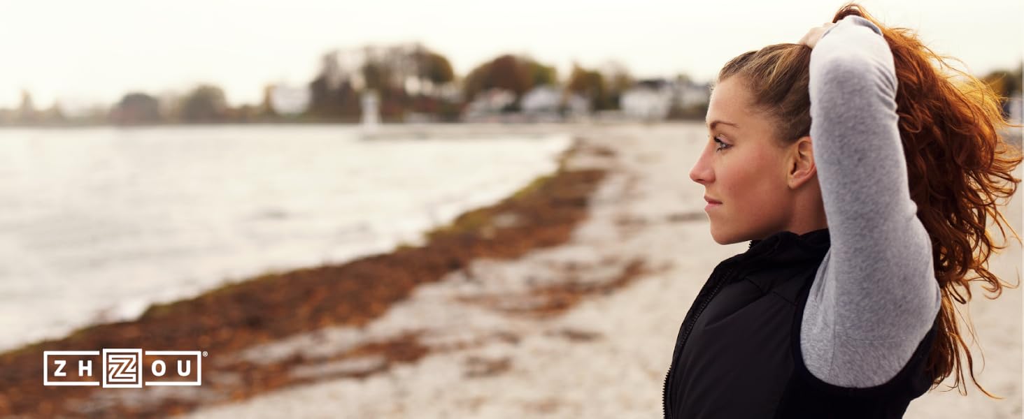 woman enjoying the outdoors near a beach