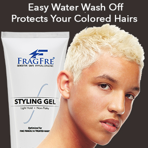 Young black man with color treated hair posing with a tube of fragfre light hold styling gel