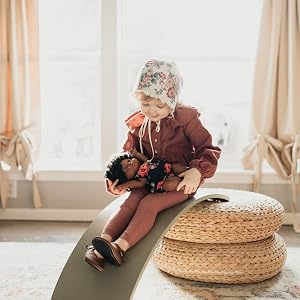 kinderfeets kinderboard upside down child sitting bridge from seat to floor indoors curtains window
