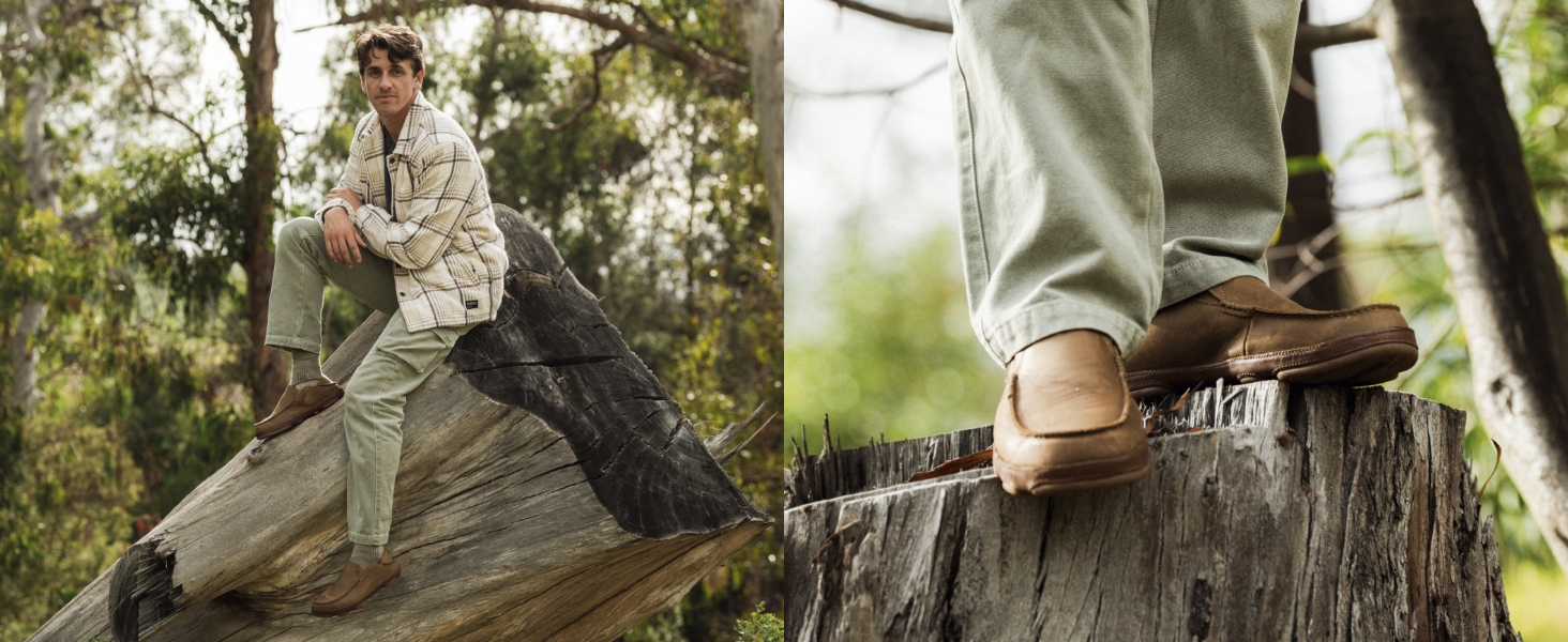 side view of Moloā on feet, man wearing Moloā slip-on shoes while sitting in a tree