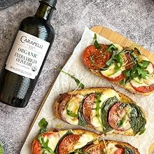 Carapelli extra virgin olive oil and tomato and cheese tostada