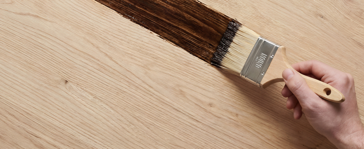Demonstration sequence showing tool being used on wooden surface, with hands manipulating the device