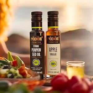 podor oil and vinegar on table with salad