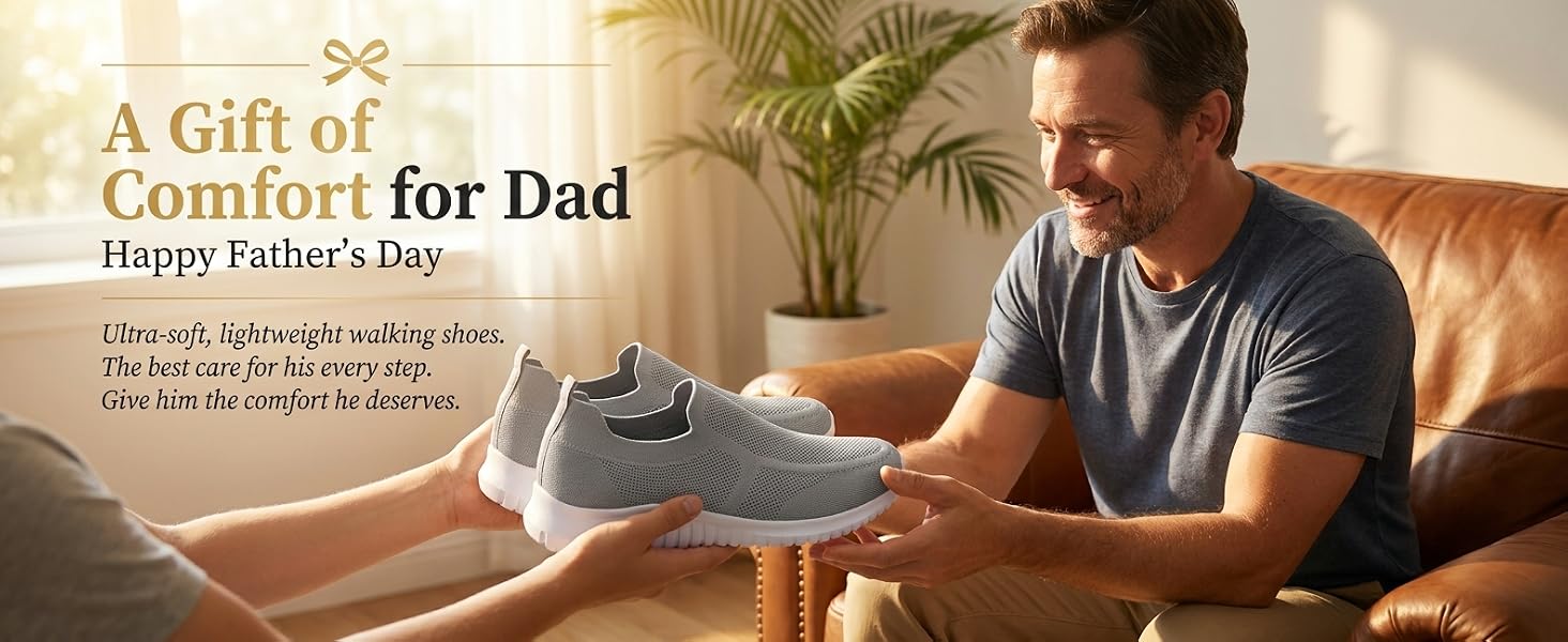 Son giving dad light gray slip-on walking shoes on a leather couch.