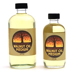 White backround with and 8 oz bottle and 4 oz bottle of Walnut Oil