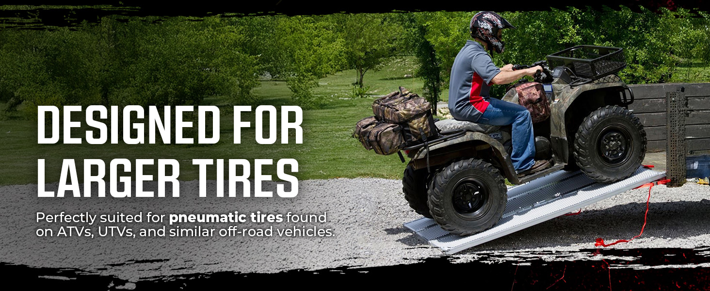 Man loading ATV onto trailer using Black Widow Aluminum Extra-Wide Folding Ramp outdoors.