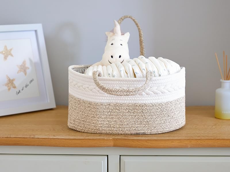 a white basket with a white starfish on top of a dresser.