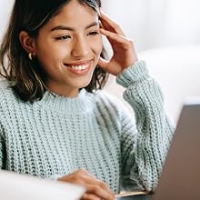 woman smiling at laptop