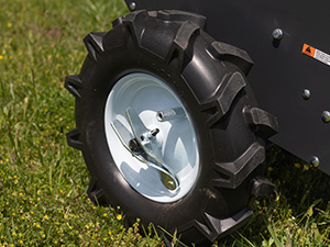 Tow-behind spreader combined with Titan finish mower accessories