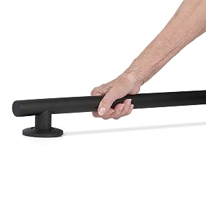 Hand gripping Coronado grab bar in a secure hold in a bathroom environment