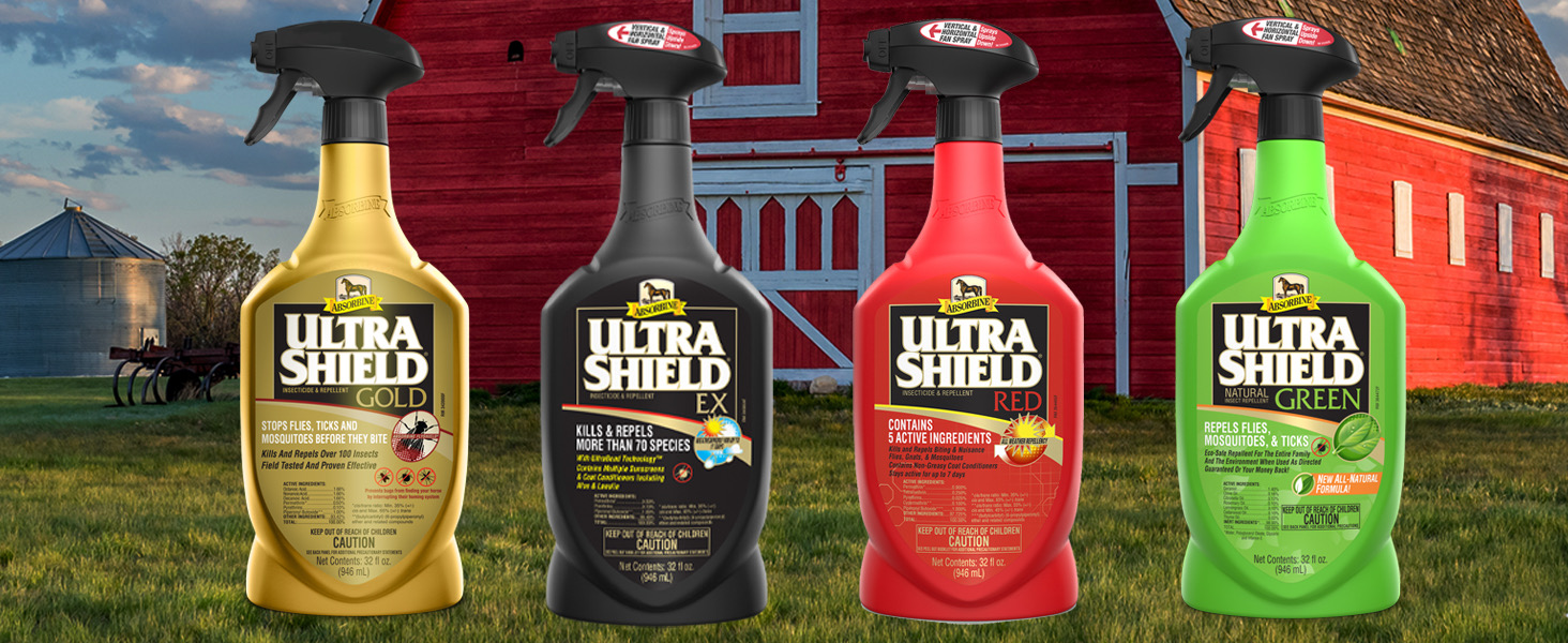 UltraShield bottles in front of a red barn