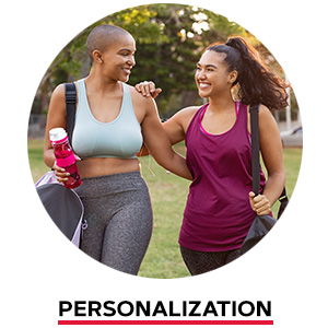 Two women wearing fitness gear walking together. Personalization.