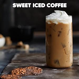 Dunkin Donuts home-brewed ground coffee is seen as sweetened iced coffee over ice in a tall glass