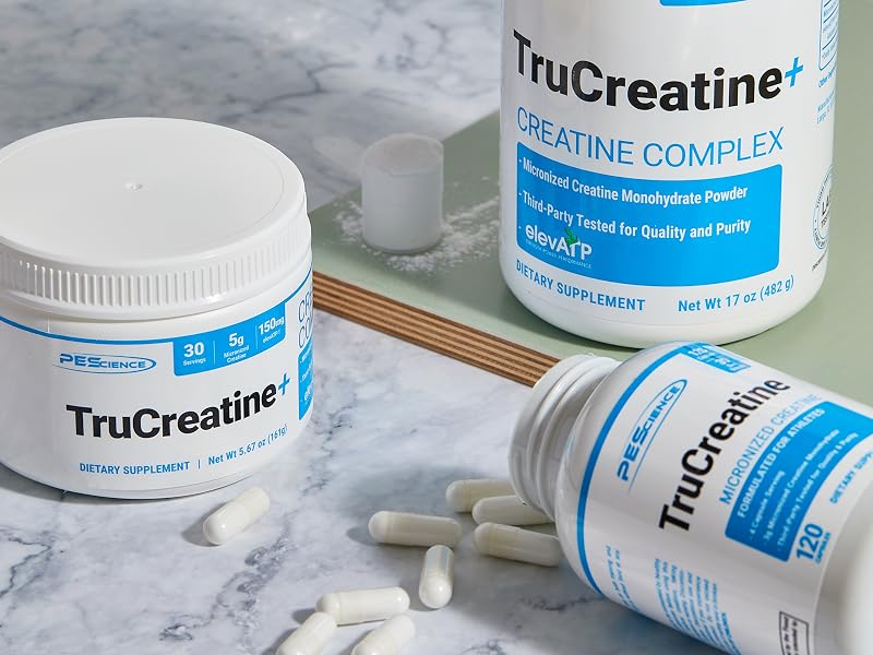 Trucreatine powder and capsules on table