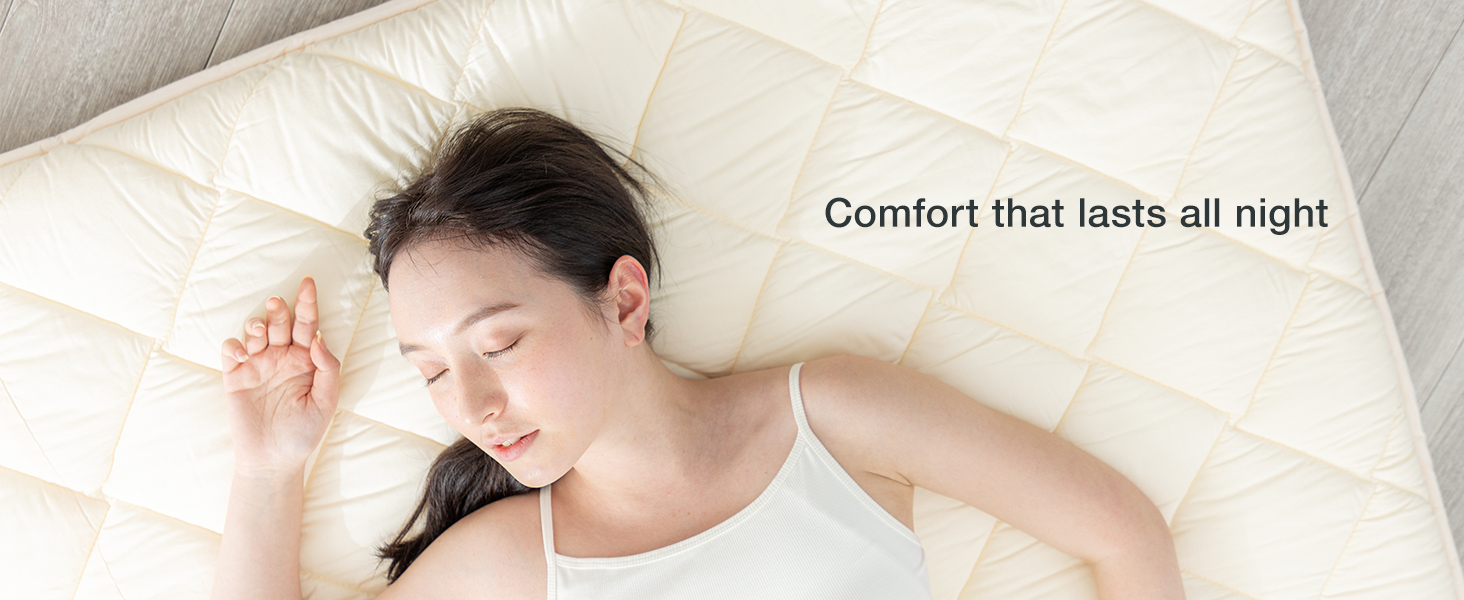Person sleeping on FULI futon designed for firm support and comfortable sleep