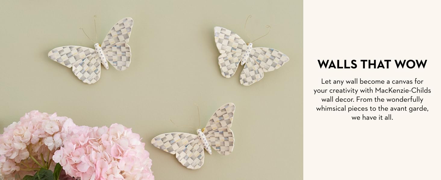 Butterflies on a beige wall.