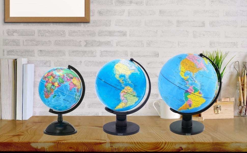 Text reads 'Image 1'. Display of multiple illuminated desk globes on wooden shelving against a white brick wall background. The globes show detailed world maps with blue oceans.