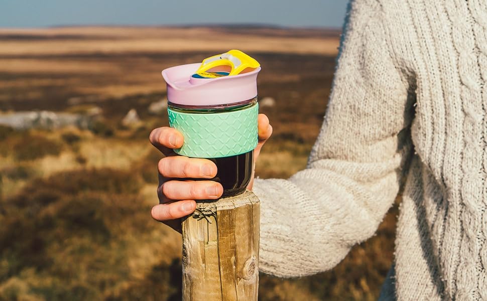 a person holding a cup of tea