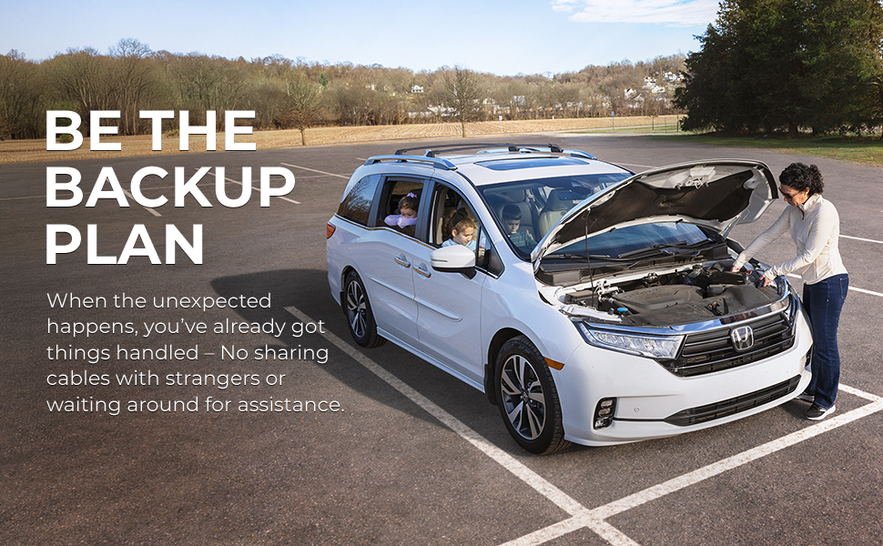 Lifestyle scene of woman jump starting minivan with kids inside, highliting roadside preparedness