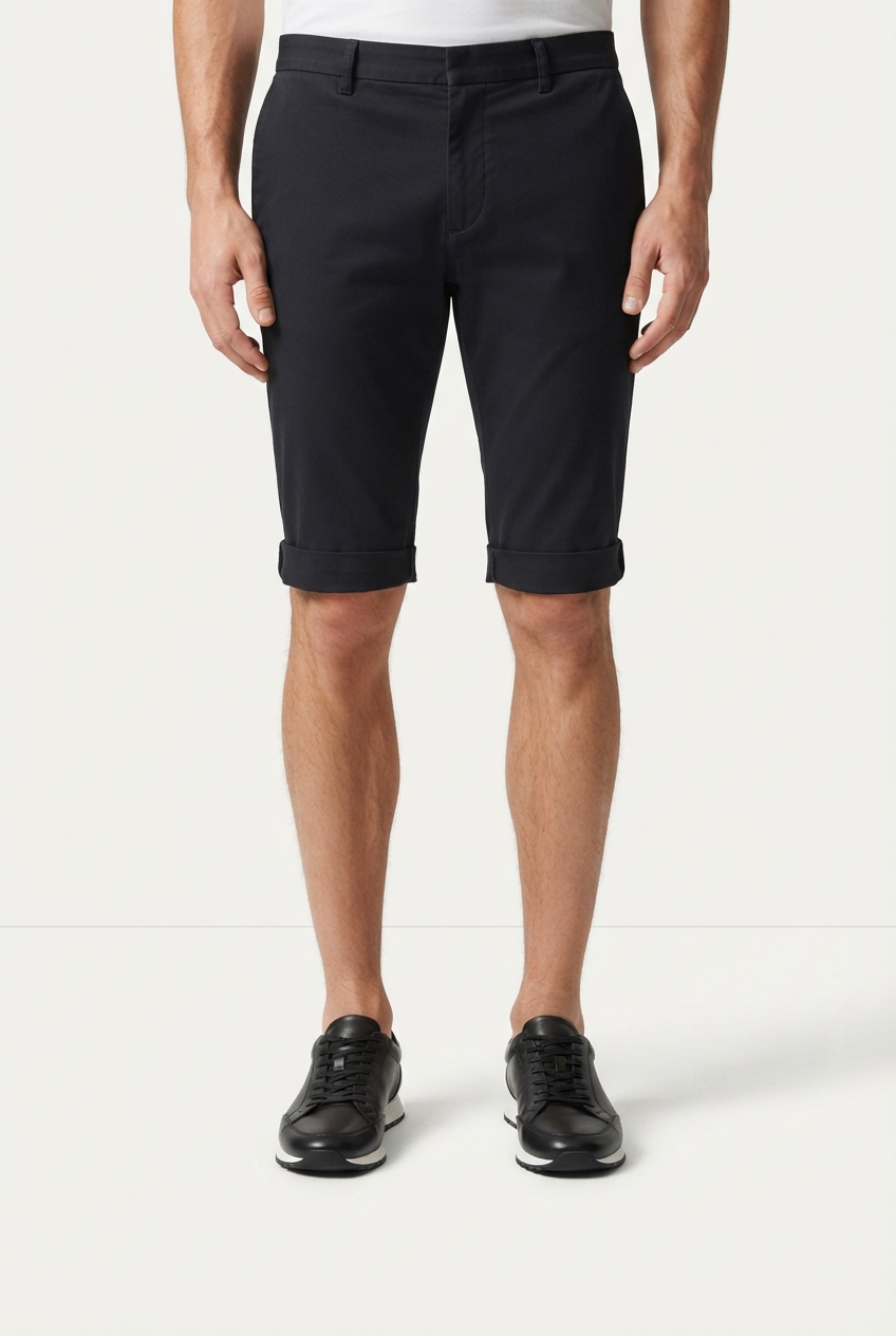 Minimalist men's black leather sneakers on model