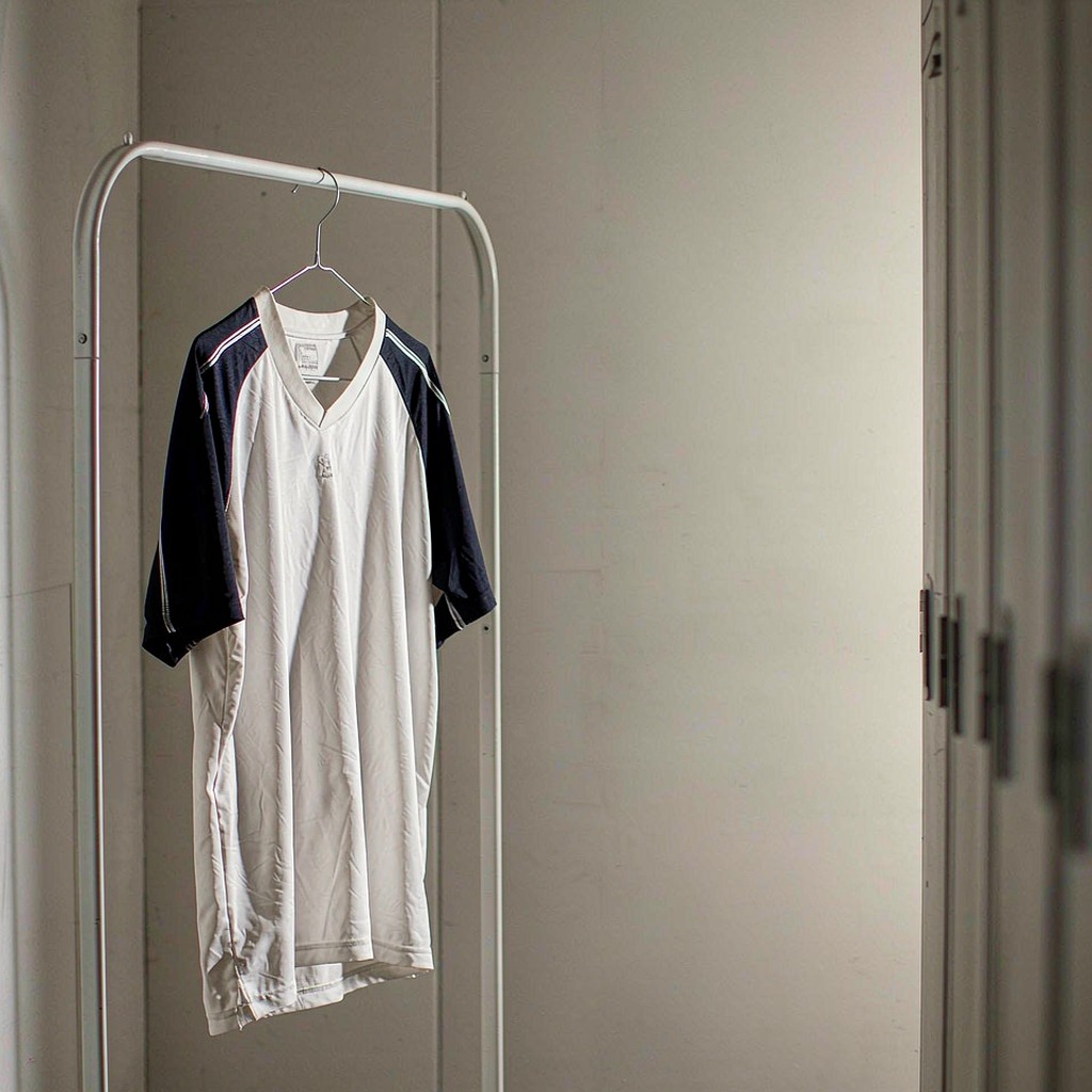 Jersey hanging in an open locker room