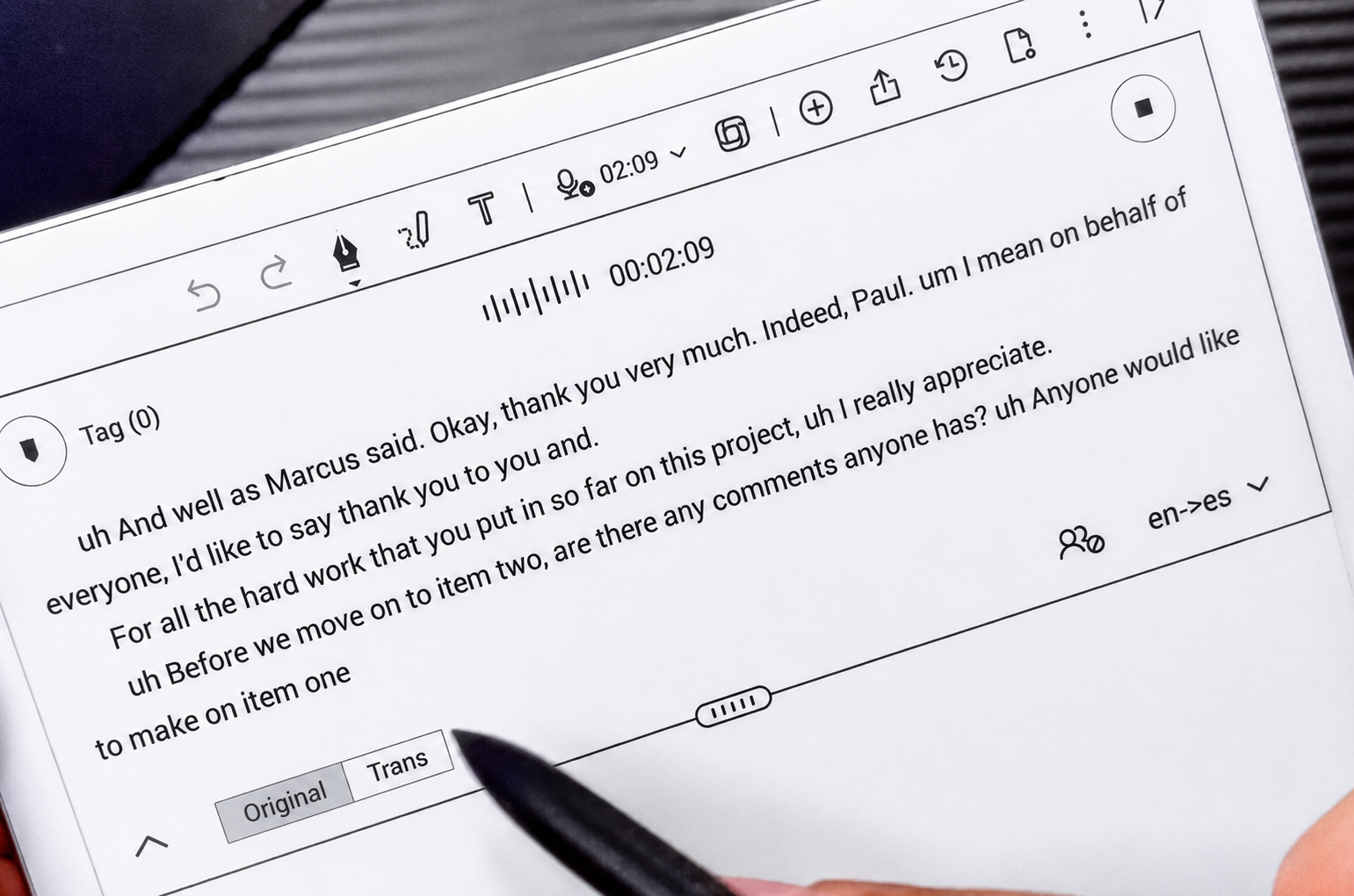 AI transcription tablet showing meeting notes and voice recording text