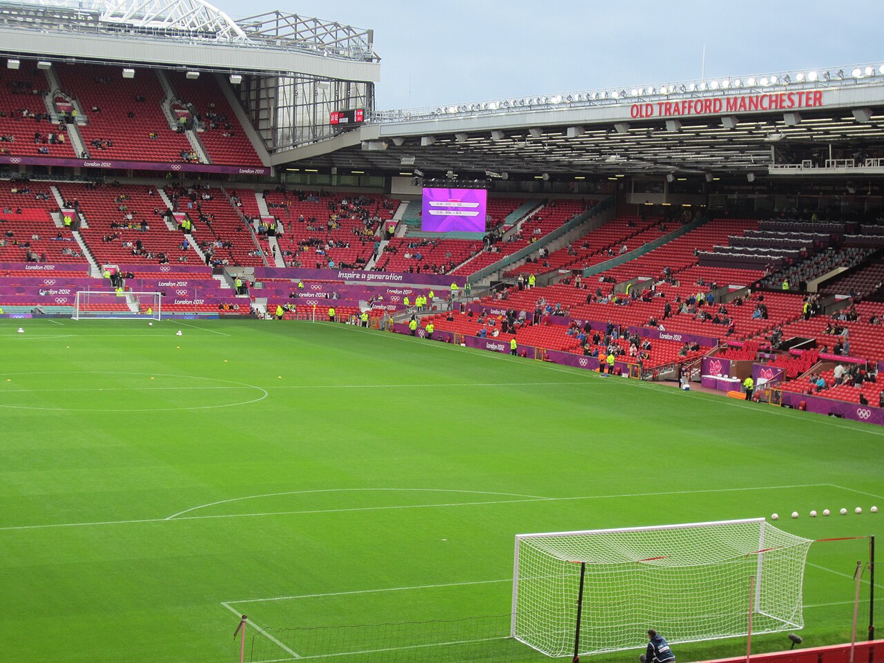 Old Trafford stadium in Manchester during an evening football match
