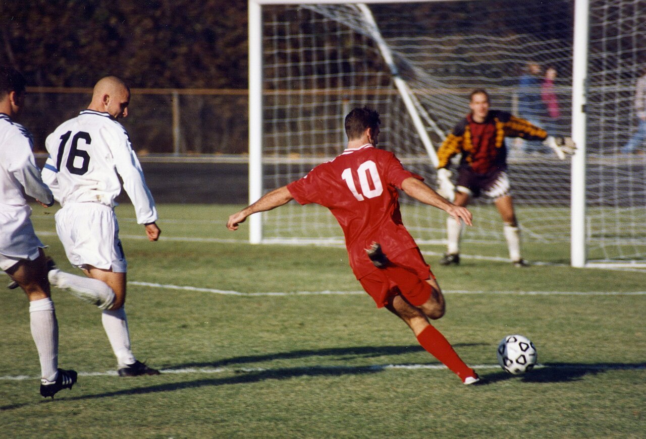 Players competing for the ball during a football match