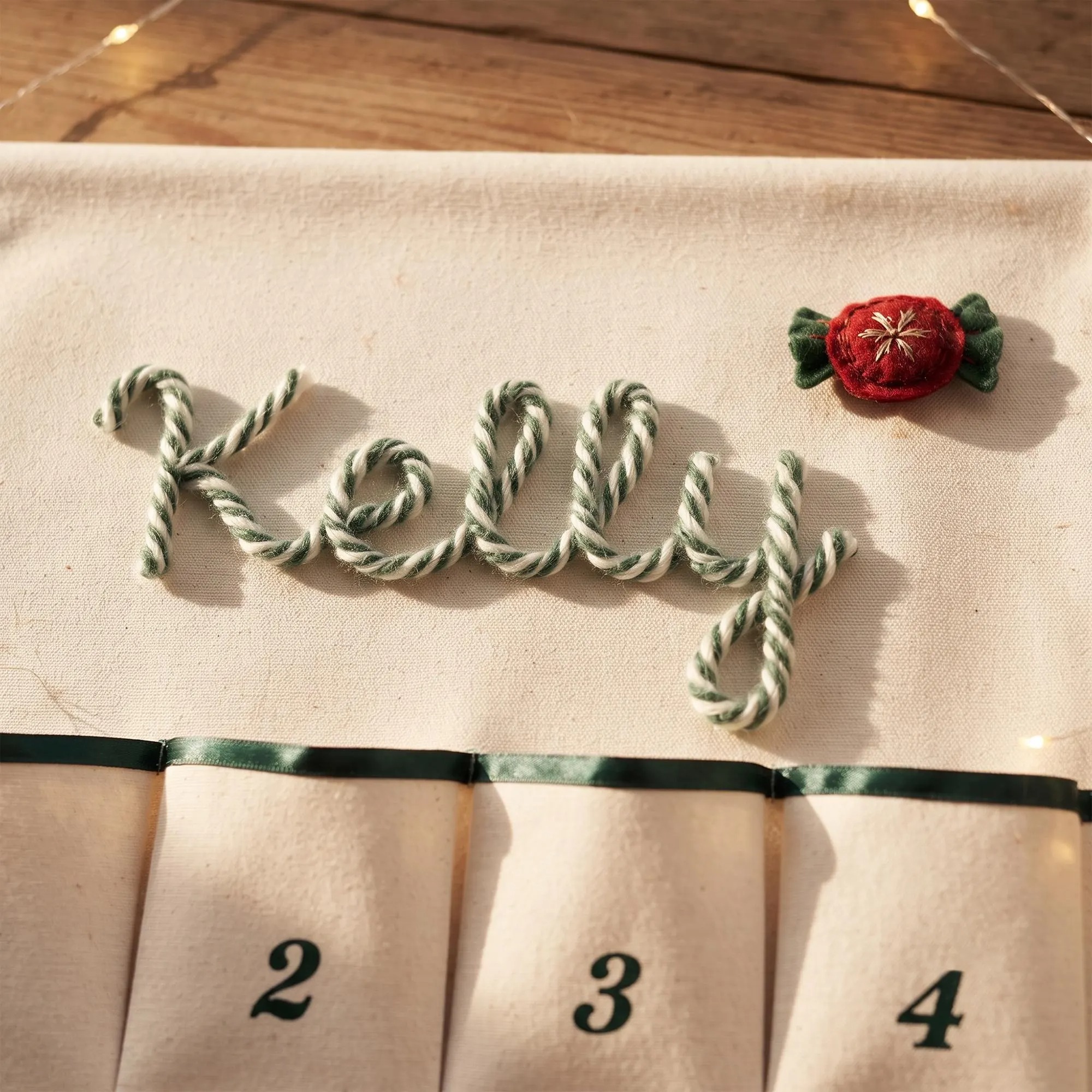 Personalized Christmas Advent Calendar – Custom Name Embroidered Fabric Countdown with 24 Pockets, Red or Green Strap, Reusable Holiday Decor for Kids & Families