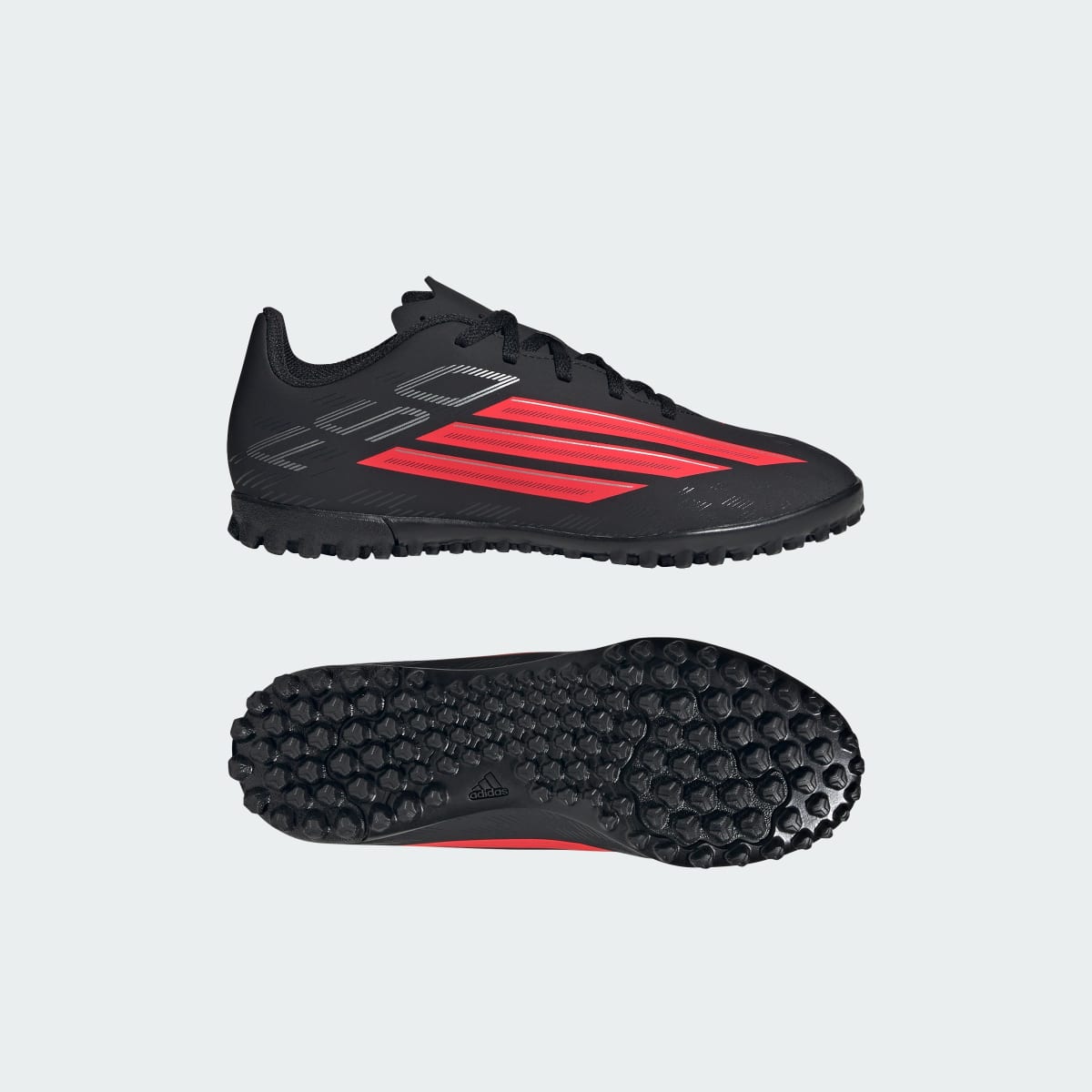 Guayos de fútbol para niños color negro y rojo - vista 1
