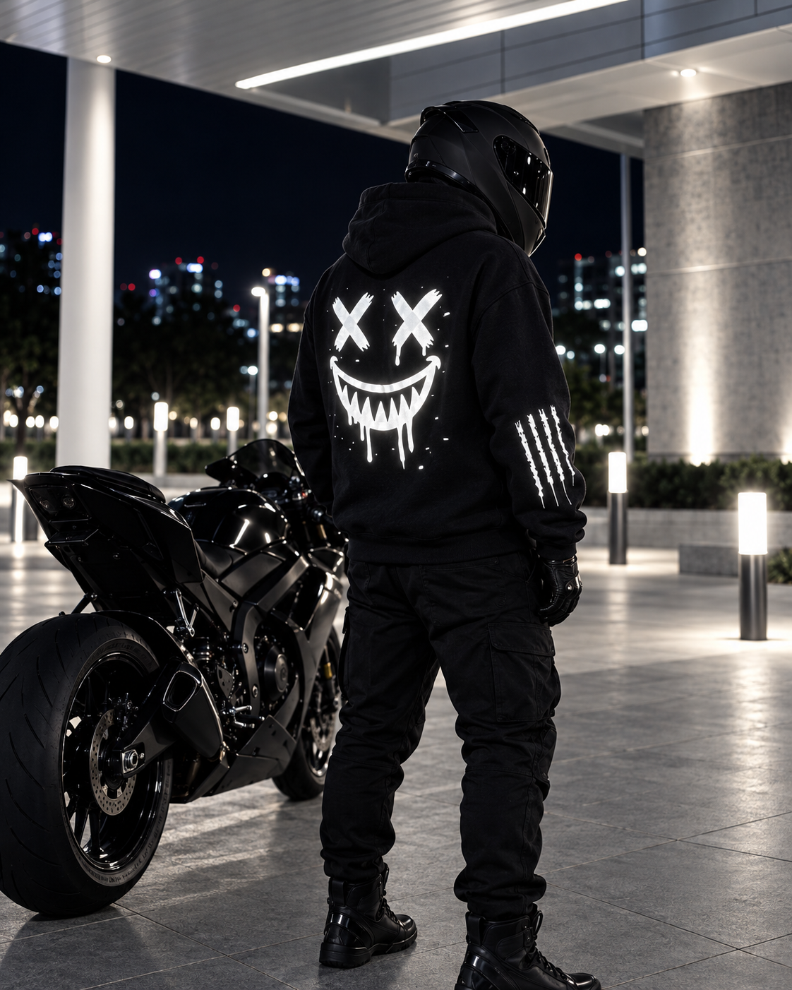Black reflective smiley motorcycle hoodie glowing at night