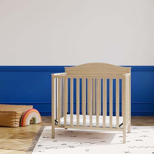 Graco Stella 4-in-1 Convertible Mini Crib with Bonus Mattress (Driftwood) – Includes Bonus 2.50 Inch Thick Mattress with Water-Resistant Cover
