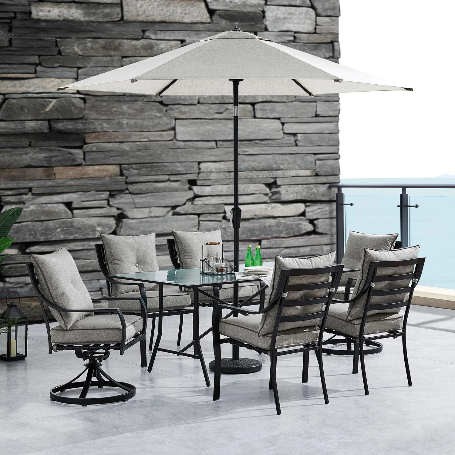 Hanover Lavallette 7-Piece Modern Outdoor Dining Set with Umbrella | 6 Cushioned Swivel Rocker Chairs | 66'' x 38'' Glass-Top Table | Weather