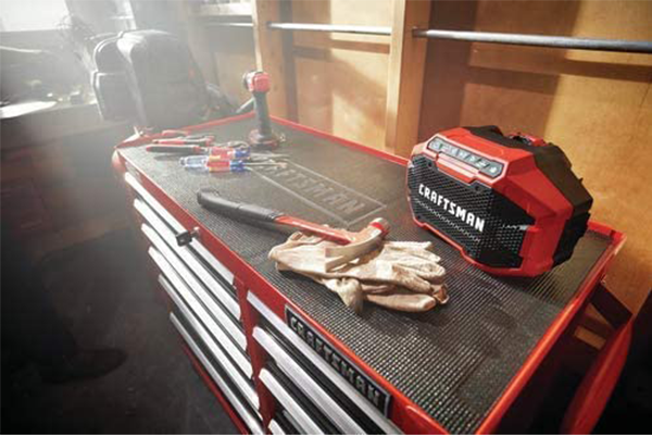 Tool cabinet with drawer lining roll and sleeve organizer