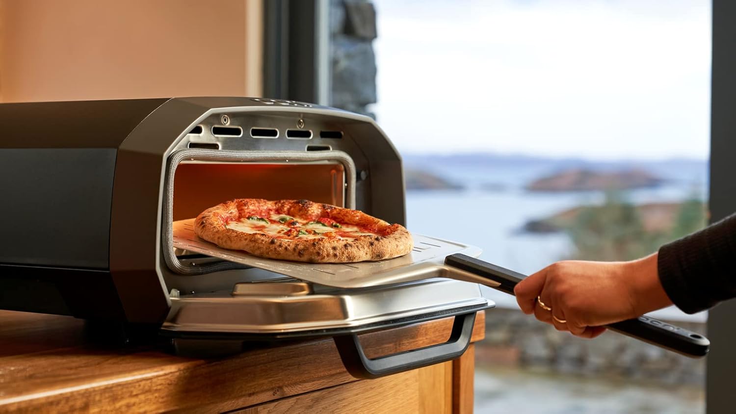 Ooni Volt 12 Electric Pizza Oven - Indoor & Outdoor Versatile Electric Oven, Pizza Cooker with Stone, Indoor and Outdoor Toaster Oven Countertop