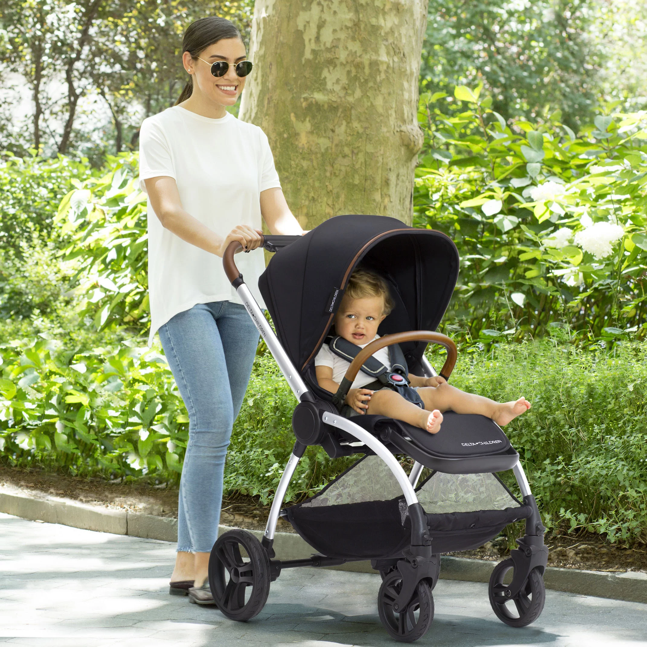 Delta Children Revolve Reversible Stroller - Leather Handlebar; One Hand Easy Fold; Lightweight Shock-Absorbing Frame