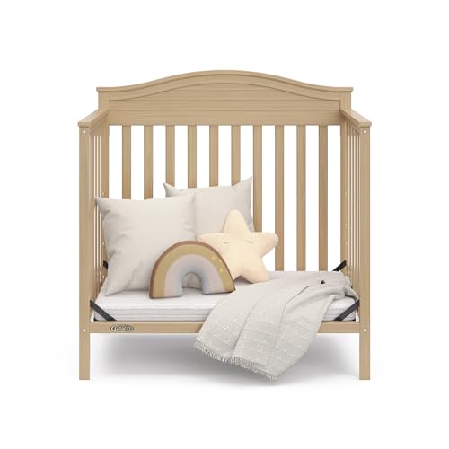 Graco Stella 4-in-1 Convertible Mini Crib with Bonus Mattress (Driftwood) – Includes Bonus 2.50 Inch Thick Mattress with Water-Resistant Cover
