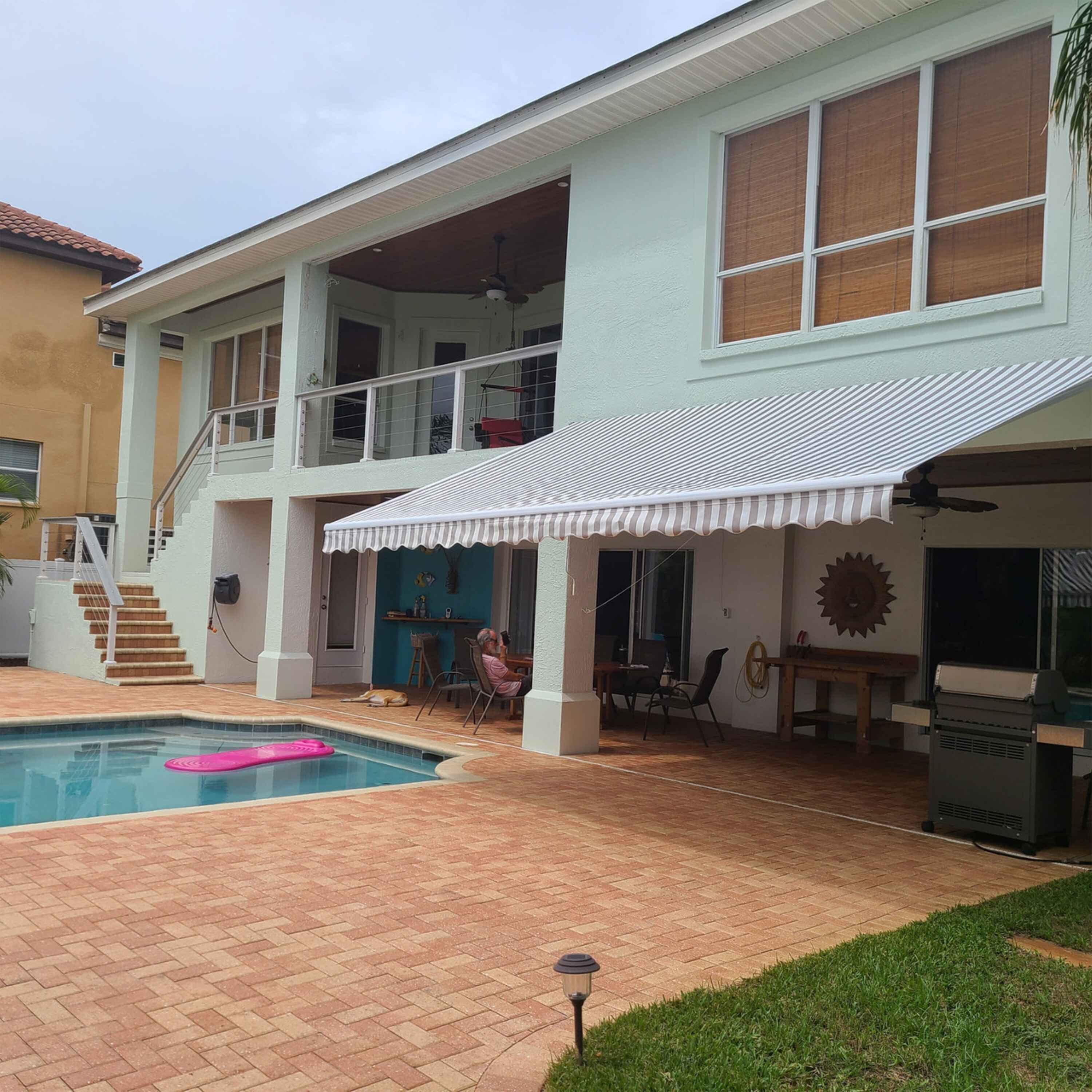 ALEKO 20' x 10' Retractable Motorized Patio Awning, Gray and White Striped Color