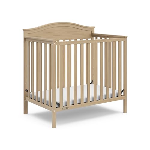 Graco Stella 4-in-1 Convertible Mini Crib with Bonus Mattress (Driftwood) – Includes Bonus 2.50 Inch Thick Mattress with Water-Resistant Cover